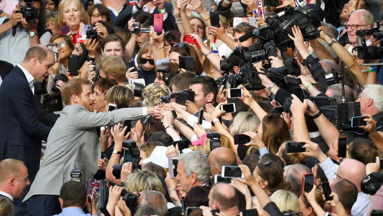 Britain's Princes Harry and William greet well-wishers outside Windsor Castle