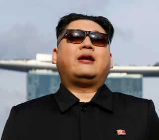 Kim Jong Un impersonator says detained at Singapore airport