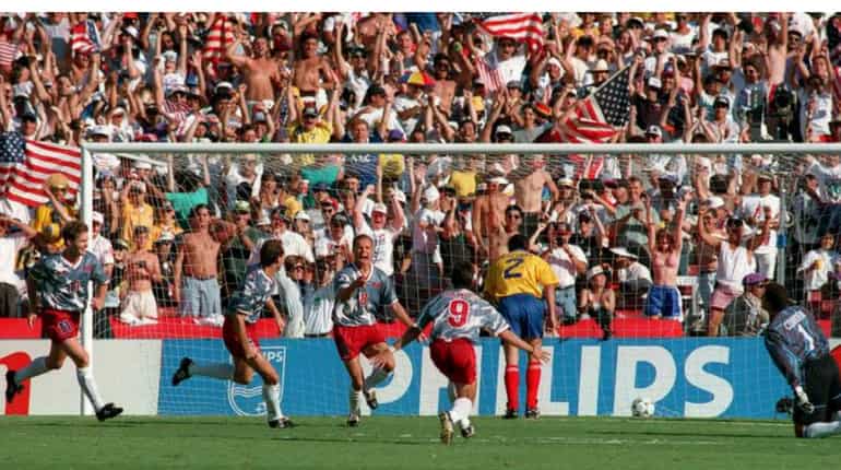 USA players celebrate as Colombia's Andres Escobar scores