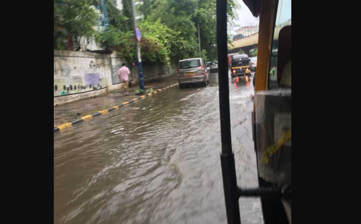 People battle knee-deep water
