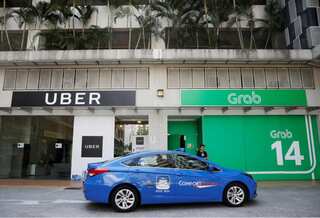Singapore watchdog says Grab-Uber deal hurts competition, proposes fines