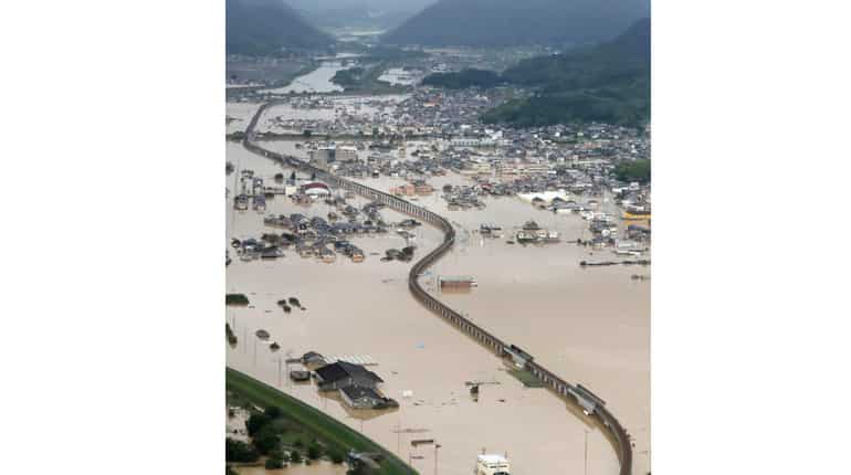 Flooded houses and a railway track in Kurashiki