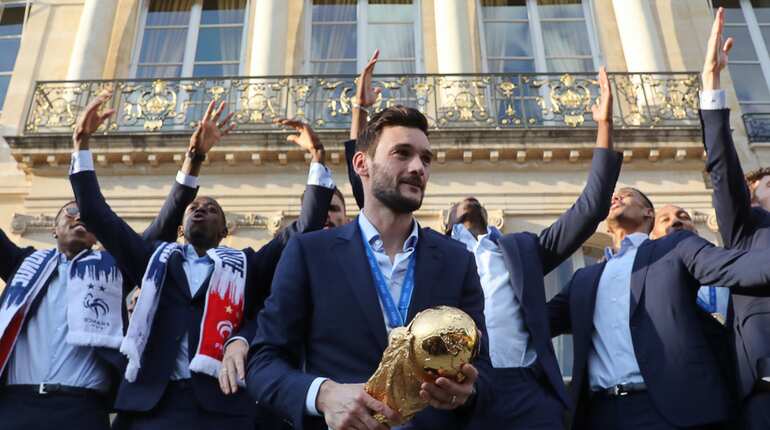 France's goalkeeper holds the winner's trophy
