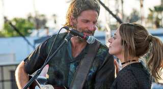 Bradley Cooper picks up his best director prize at the National Board of Review Awards