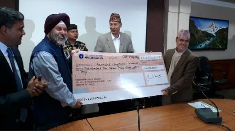 India hands over 2.1 billion to Nepal Government to reconstruct houses India hands over 2.1 billion to Nepal Government to reconstruct houses