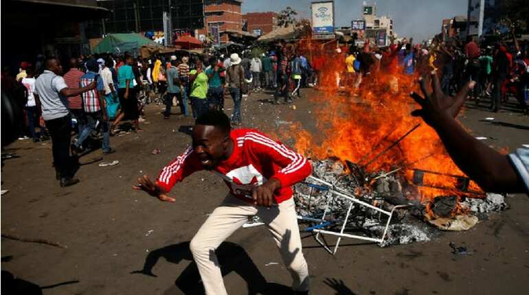 Three killed in Zimbabwe as soldiers disperse stone-throwing opposition supporters Three killed in Zimbabwe as soldiers disperse stone-throwing opposition supporters