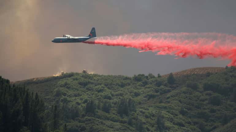 Firefighters gain on California blaze, last four missing found alive
