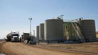 Oil rises on expected OPEC cuts, but surging US supply drags