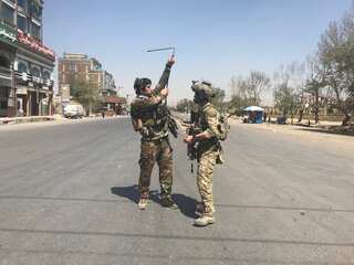 At least 13 dead in suicide attack on Afghan election rally