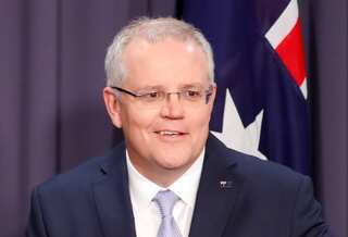 Australian PM visits firefighters after stirring controversy for Hawaii vacation