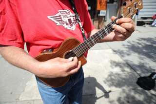 Customers strum music in Manila's ukulele cafe