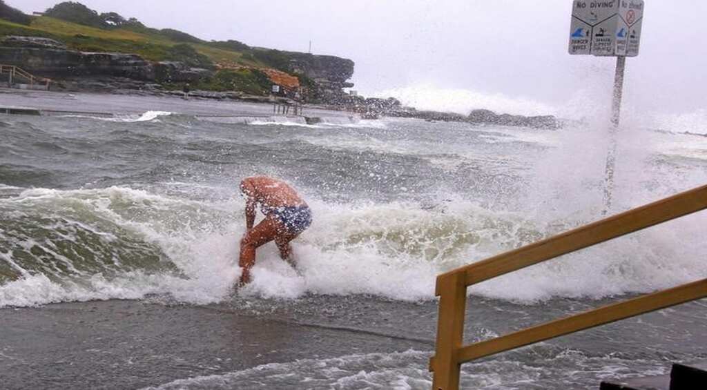 Australia storm sweeps three to their death as it hits east coast