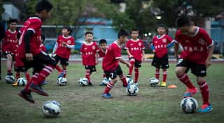 China probes artificial turfs in schools after students fall ill