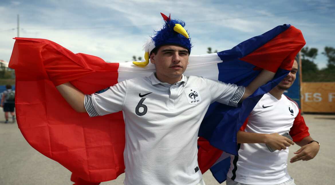 French football fans walk to the fan zone ahead of the opening game of the UEFA Euro 2016 tournament later today, on June 10, 2016 in Marseille, France.