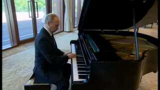 As he awaits talks with China's Xi, Putin plays piano
