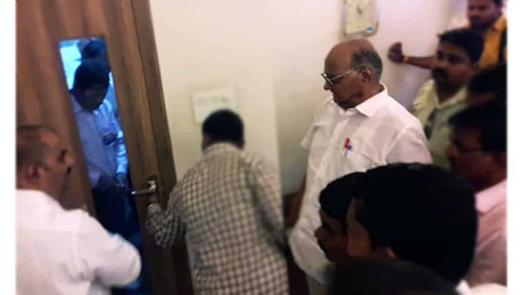 Watch: Sharad Pawar calls press conference, gets stuck in room