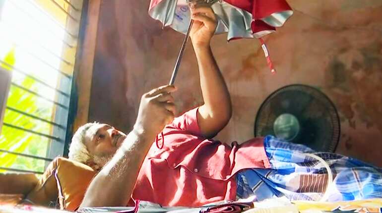 Paralysed man inspires others of his kind by making umbrellas in southern India