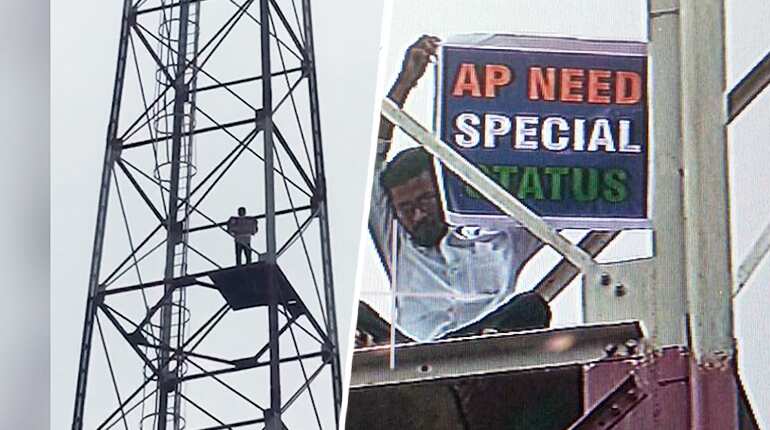 Watch: Man climbs tower in Delhi to demand special status for Andhra Pradesh Watch: Man climbs tower in Delhi to demand special status for Andhra Pradesh