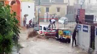 Watch: Men escape from car in Uttarakhand as vehicles disappear in floods