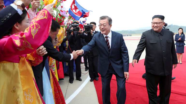 Leaders of two Koreas hold summit, parade down streets of Pyongyang in Kim's limo