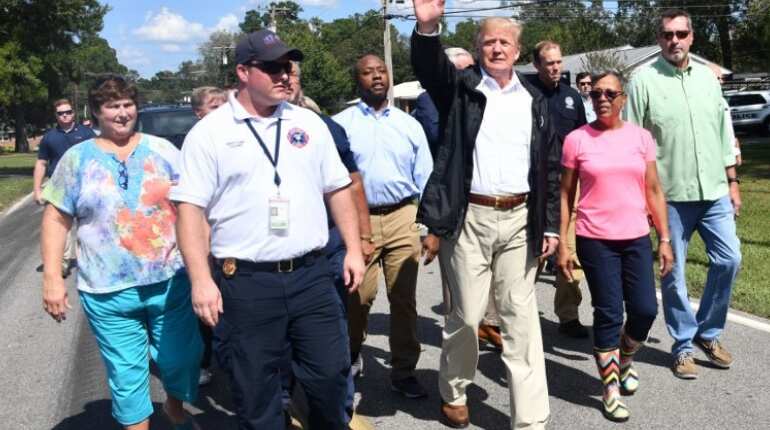 Trump vows '100 per cent' support for storm-battered Carolinas Trump vows '100 per cent' support for storm-battered Carolinas