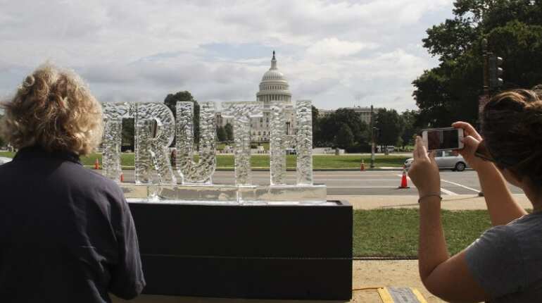 Melting ice sculpture protests 'fake news' at US Capitol