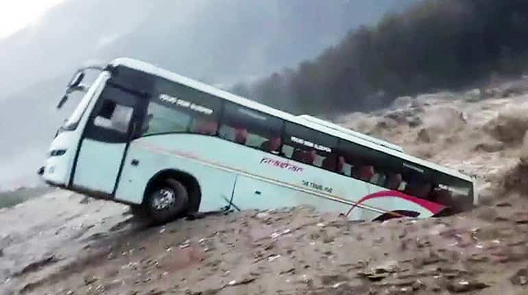 Bus swept away in north India floods