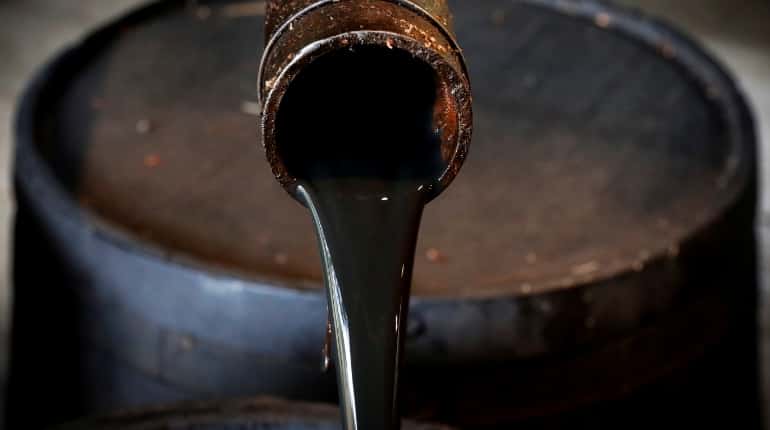 Oil prices edge up as OPEC says its crude output fell sharply in December