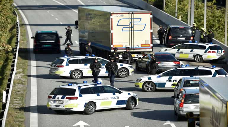 Denmark shuts links to Sweden and Germany as police hunt car