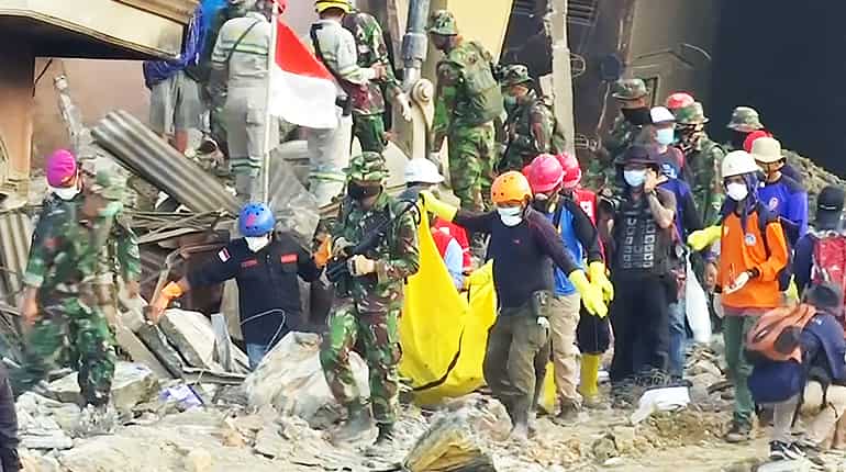 'I'm here to find my family's corpses': Indonesians join search for quake victims