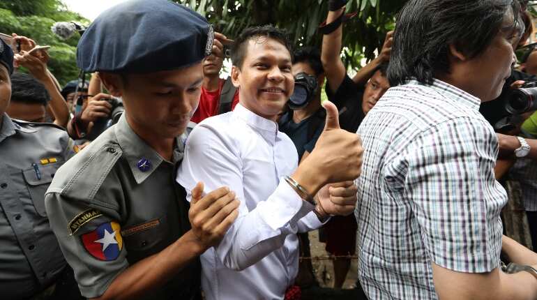 Myanmar newspaper journalists held after handing themselves in to police
