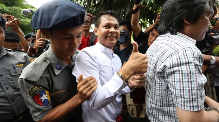 Myanmar newspaper journalists held after handing themselves in to police