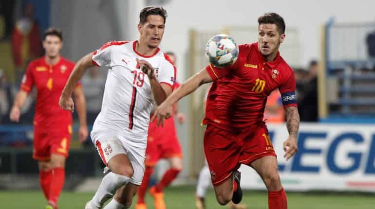 Mitrovic double gives Serbia 2-0 win at Montenegro Mitrovic double gives Serbia 2-0 win at Montenegro