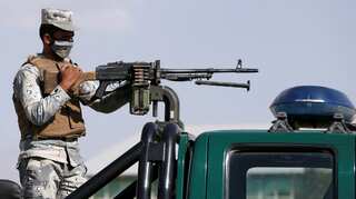 Afghan voters brave attacks, delays on election day