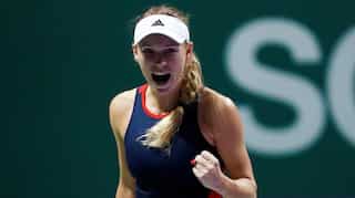 WTA Finals: Despite knee injury, defending champion Wozniacki beats Petra Kvitova