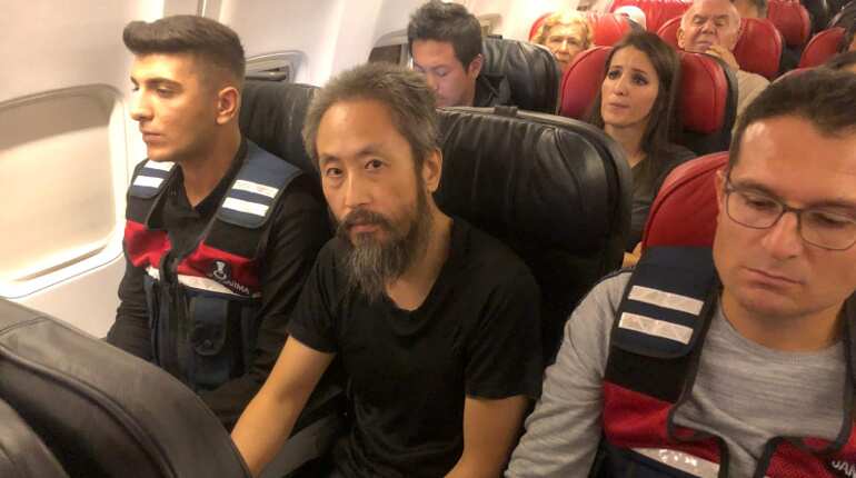 Japanese journalist held hostage by militants in Syria heads home