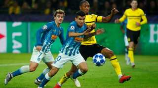 Sparkling Dortmund crush Atletico 4-0 to top Group A