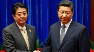 Japan's PM Shinzo Abe makes rare China visit as relations thaw