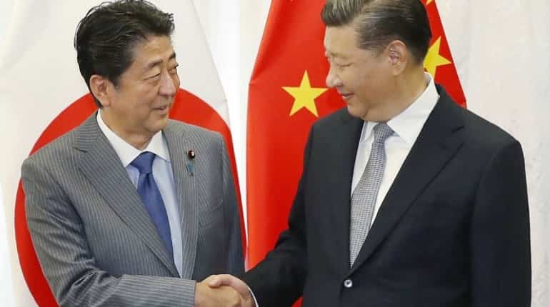 Japan, China strike deals during Abe visit as ties improve Japan, China strike deals during Abe visit as ties improve