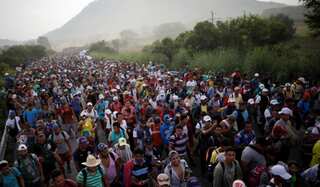 Mexico honors migrants at Day of the Dead as caravan treks north