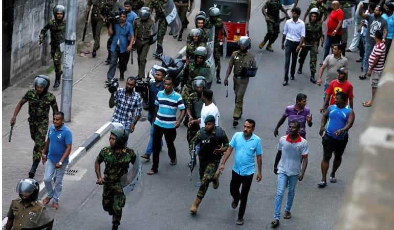 Thousands march in support of Sri Lanka's new government Thousands march in support of Sri Lanka's new government