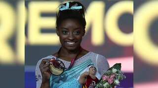 Gymnast Simone Biles claims record 13th world gold medal