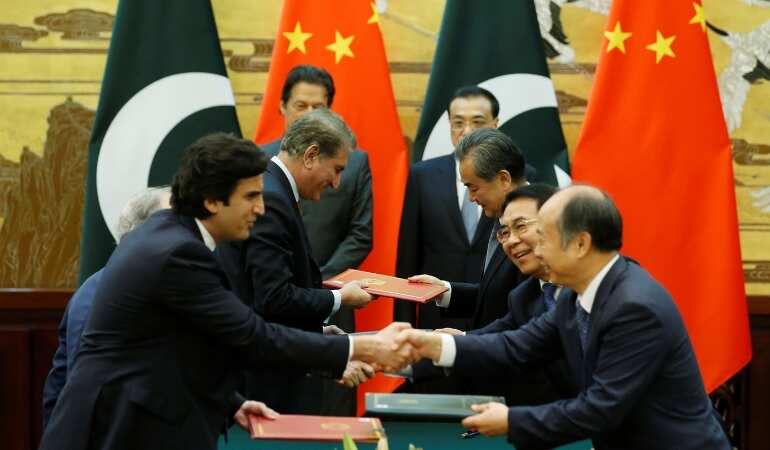 China vows 'necessary support' to cash-strapped Pak as both countries ink 16 pacts