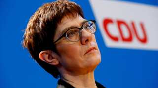 Angela Merkel's party in crisis after 'heir' quits over far right row