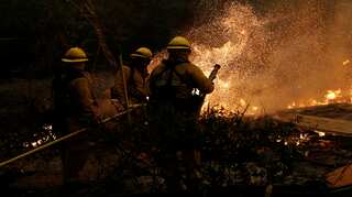 Nine die in California wildfires, 150,000 forced to flee