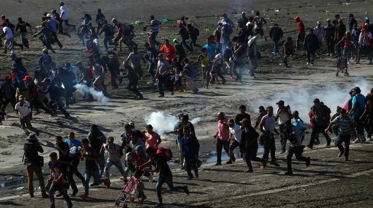 Mexico deports scores of Central American migrants who stormed US border Mexico deports scores of Central American migrants who stormed US border