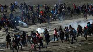 Mexico deports scores of Central American migrants who stormed US border