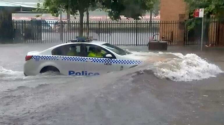 Torrential rain lashes Sydney causing flash flooding