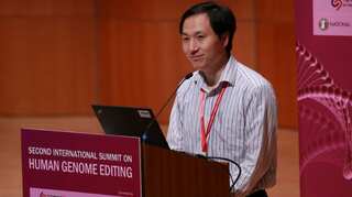Chinese scientist who edited babies' genes says trial paused, but he is proud of his work