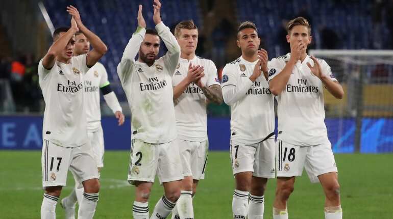 Real Madrid seal top spot with 2-0 win at Roma Real Madrid seal top spot with 2-0 win at Roma